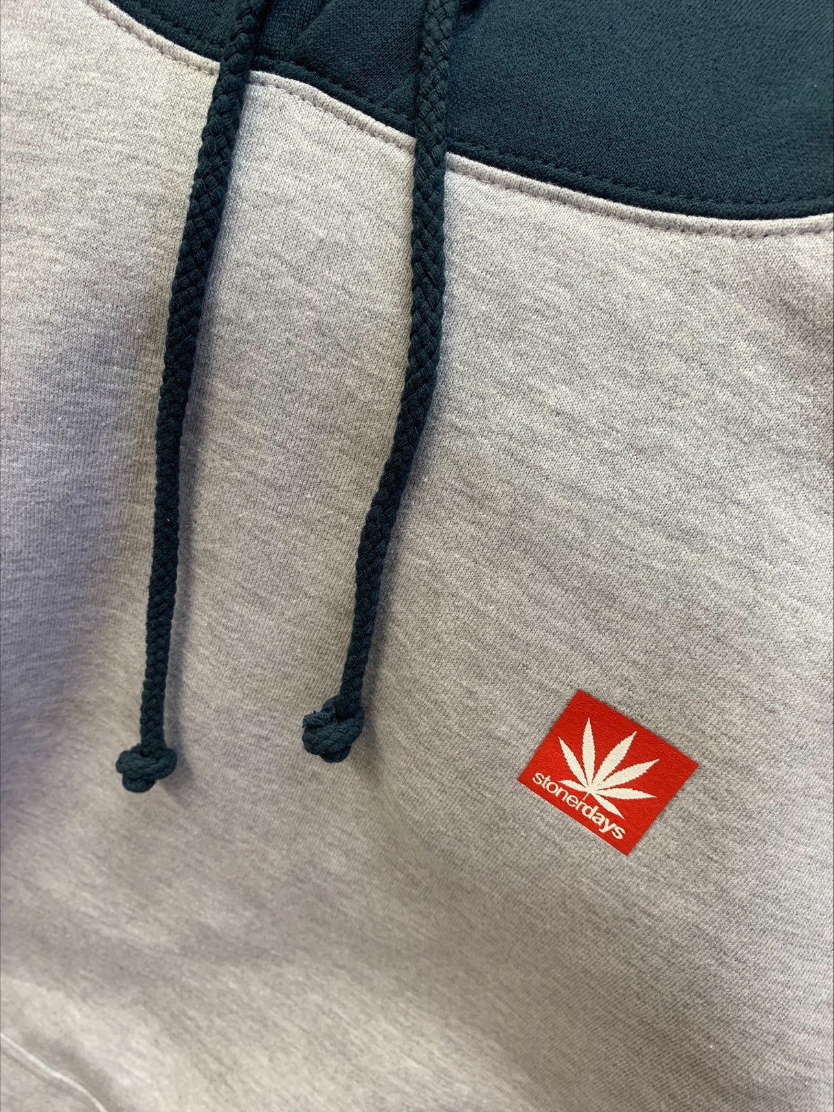 Close-up of StonerDays Two Tone Hoodie in small, showcasing the brand logo and drawstrings