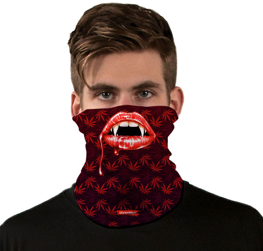 StonerDays Vampire Fangs Neck Gaiter with cannabis leaf pattern, front view on model