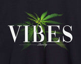 Close-up of StonerDays Vibes Hoodie with cannabis leaf design and logo on black cotton