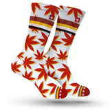 StonerDays vibrant red and yellow marijuana leaf patterned socks, front view on white background