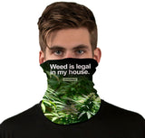 Front view of a person wearing StonerDays Weed Is Legal In My House Neck Gaiter with cannabis design