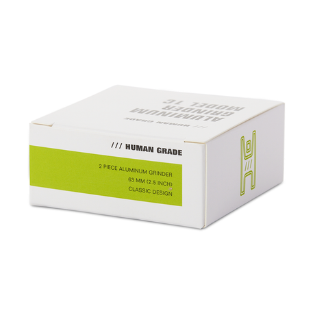 Human Grade 1C 2.5" 2-Piece Grinder in box, front view on seamless white background