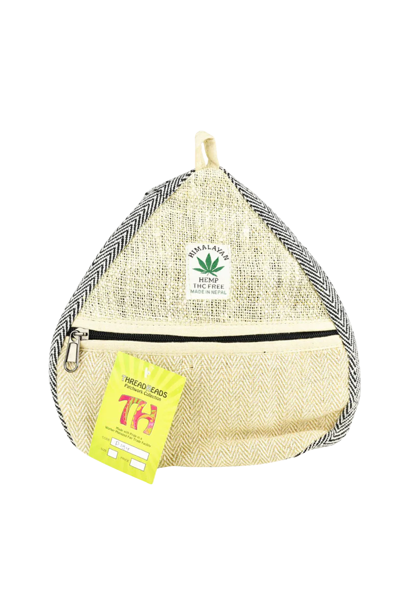 ThreadHeads Himalayan Hemp Convertible Sling Pack in tan with black strap, front view on white background