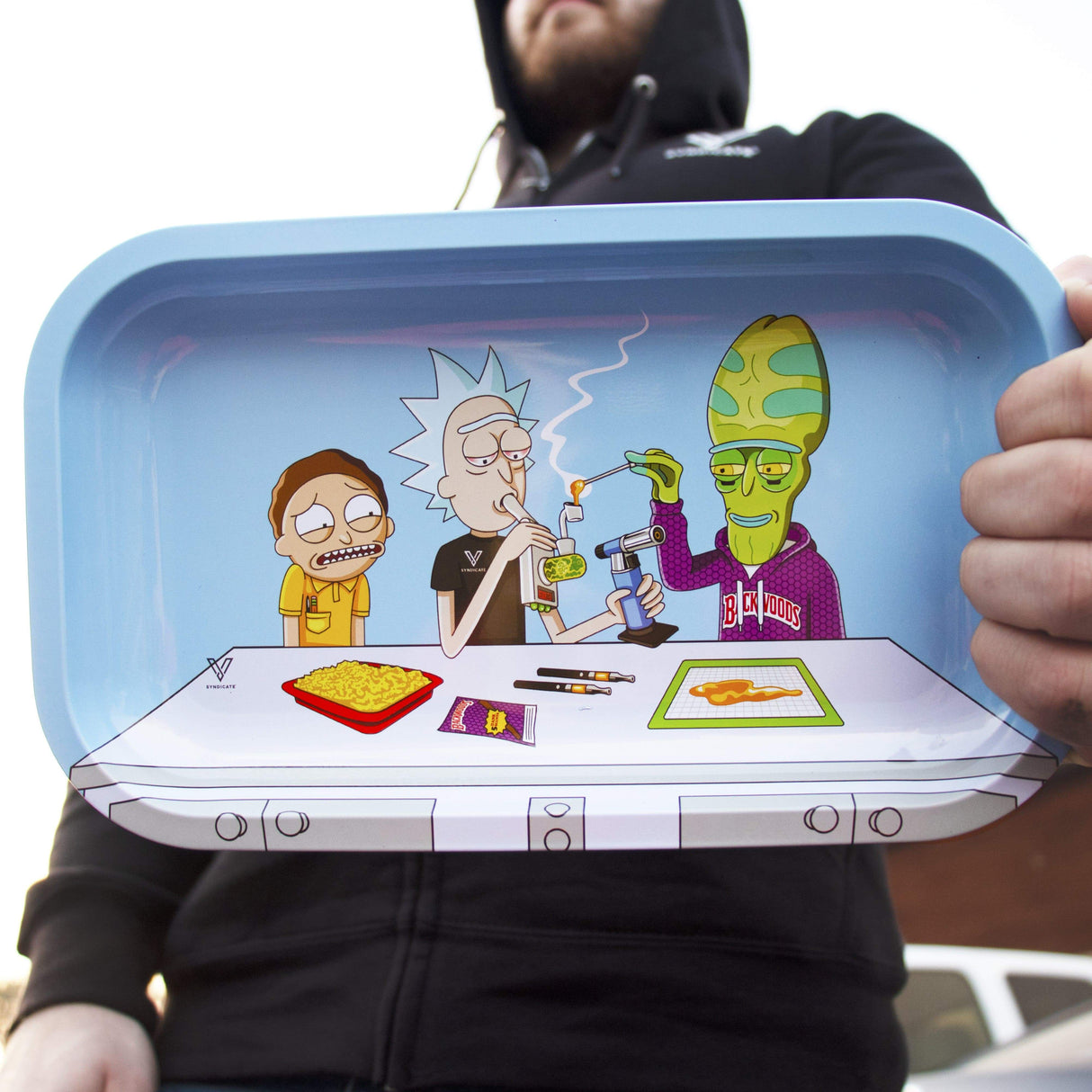 V Syndicate Dab Portal Metal Rollin' Tray with colorful cartoon design, held by person