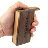 Hand holding PILOT DIARY Wooden Magnetic Dugout with Sliding Top - Close-up View